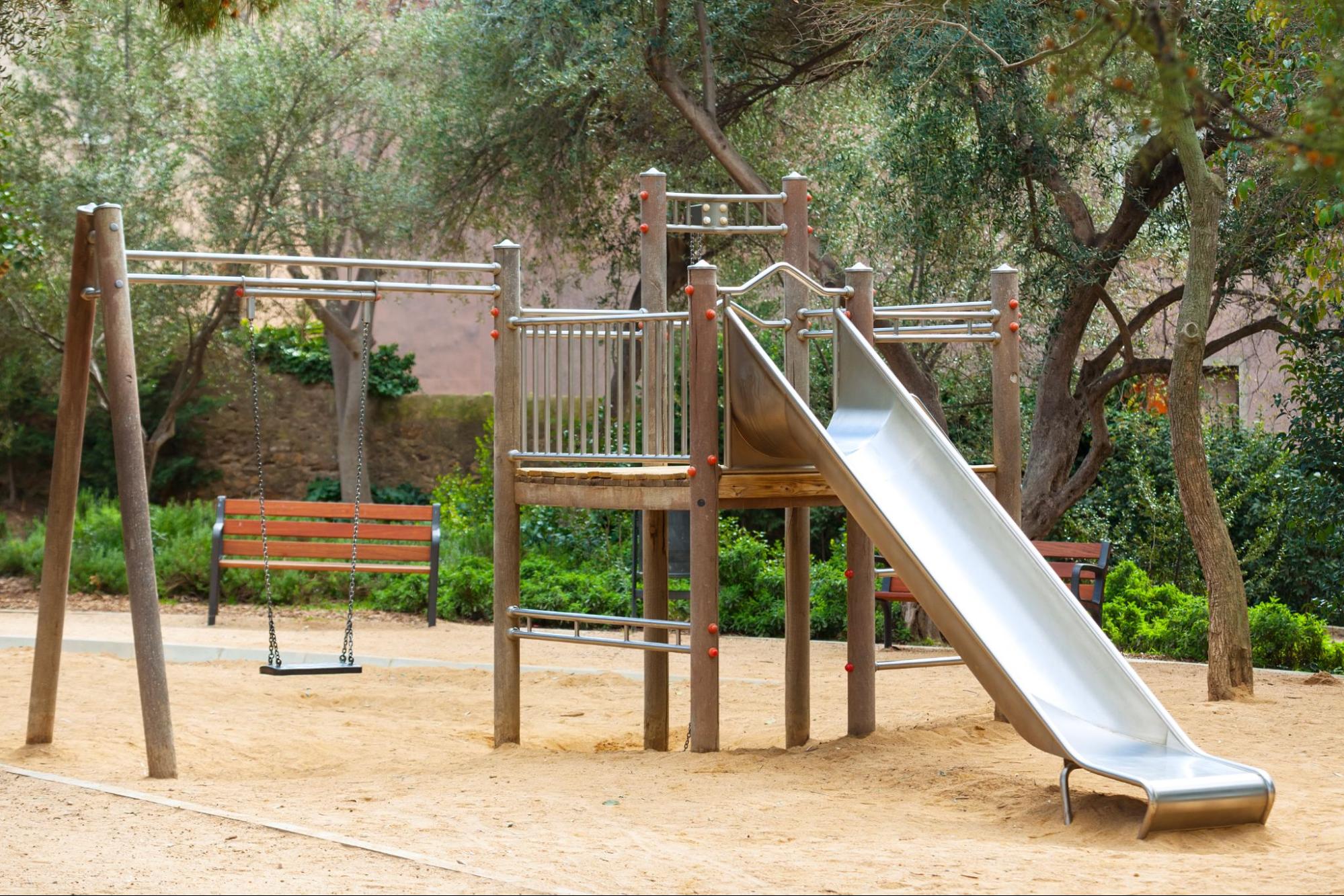 Metal slides can cause burns and should be replaced with safe playground materials like plastic.