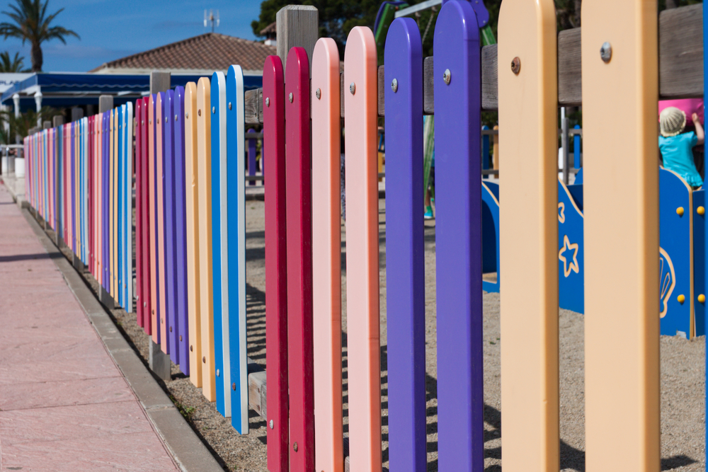 A colorful playground fence