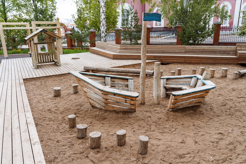 Wooden play elements on a Montessori playground